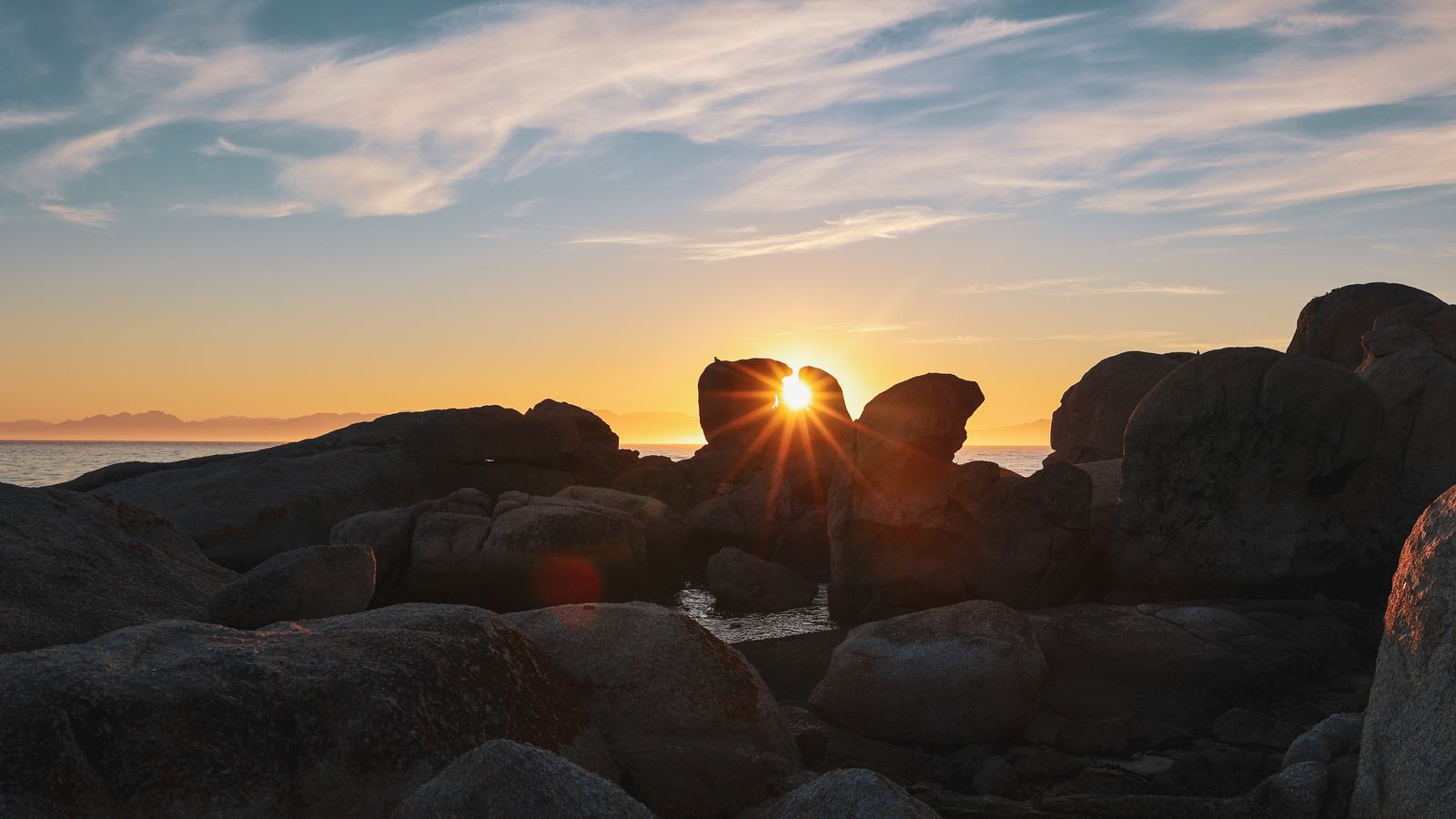 Sunrise through the boulders at Simon's Town