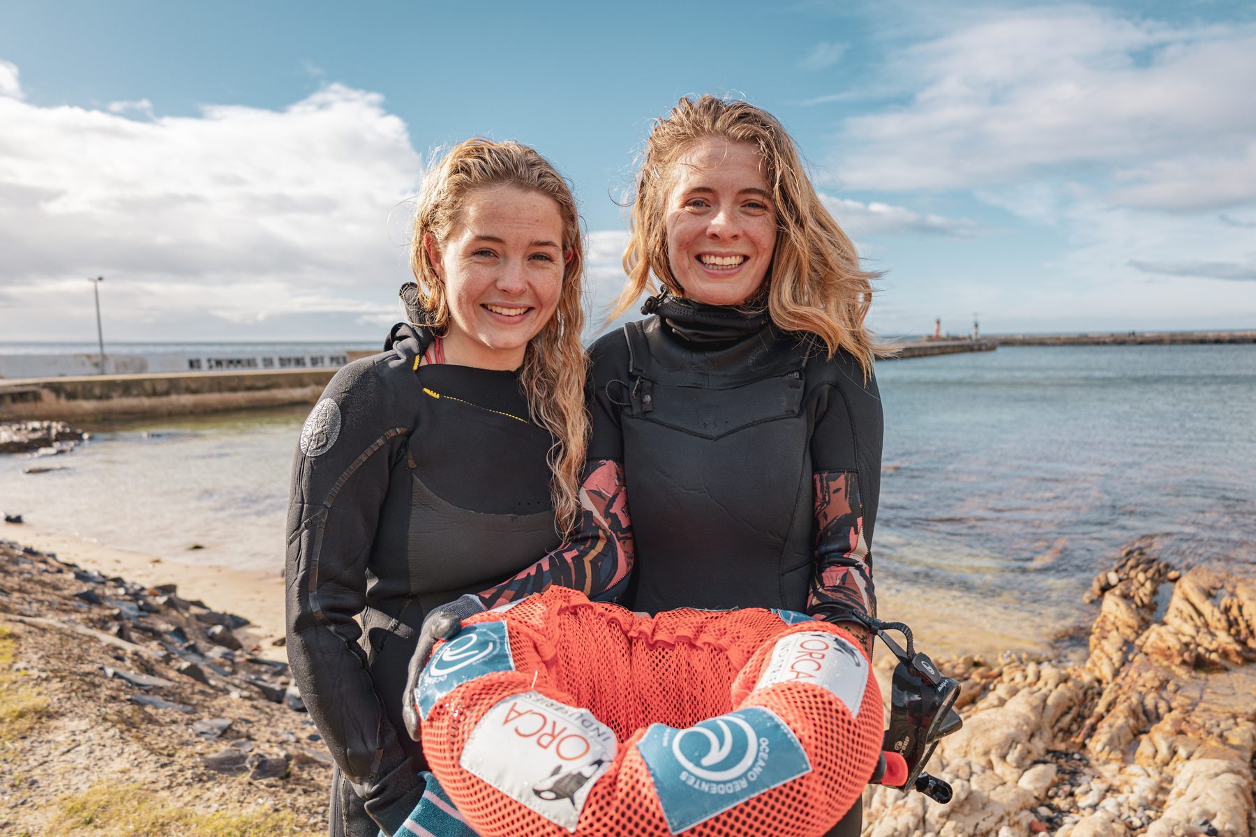 Two divers after a harbour clean-up in Kalk Bay