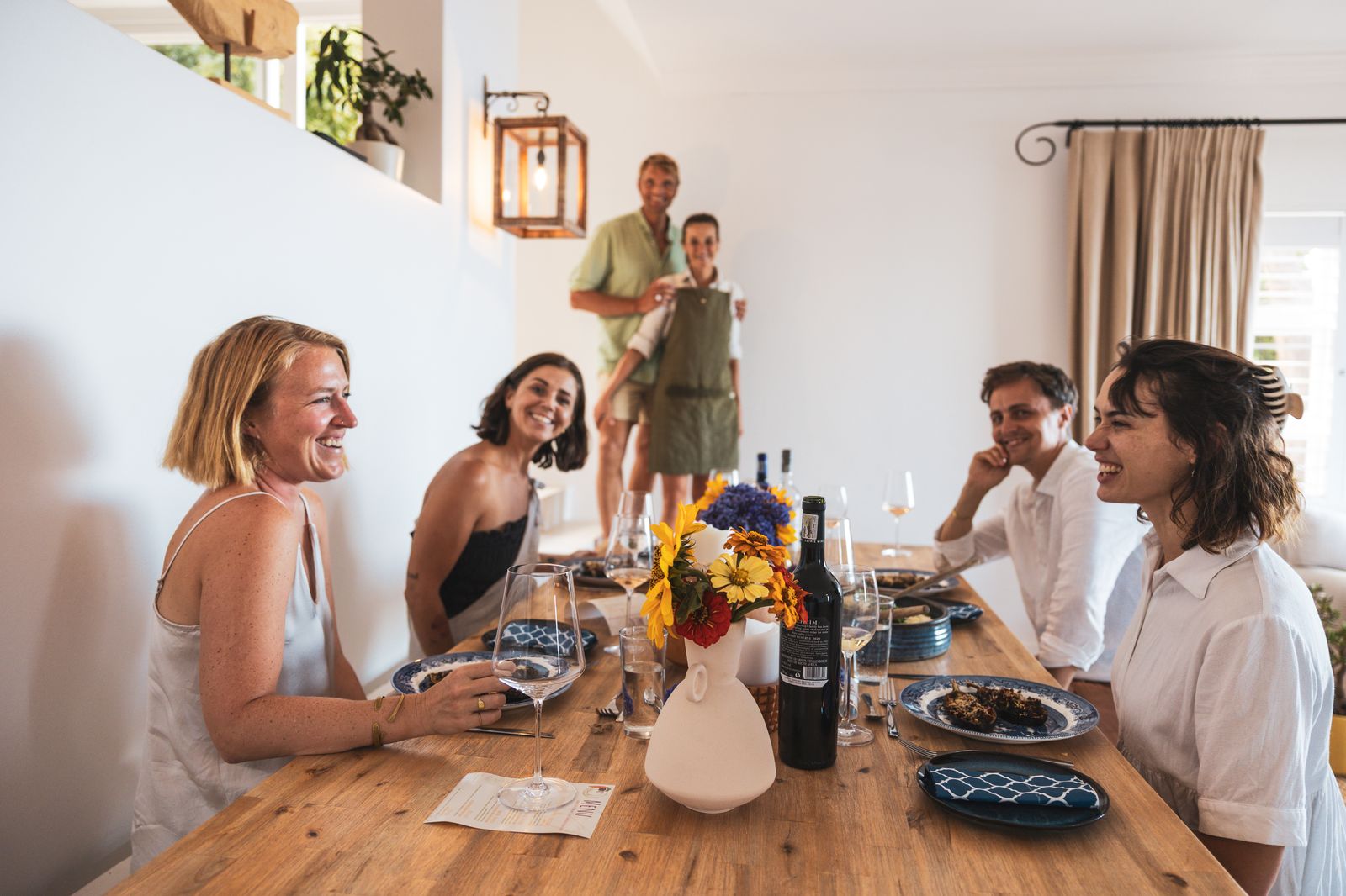 Guests around the dinner table at Palm Rock