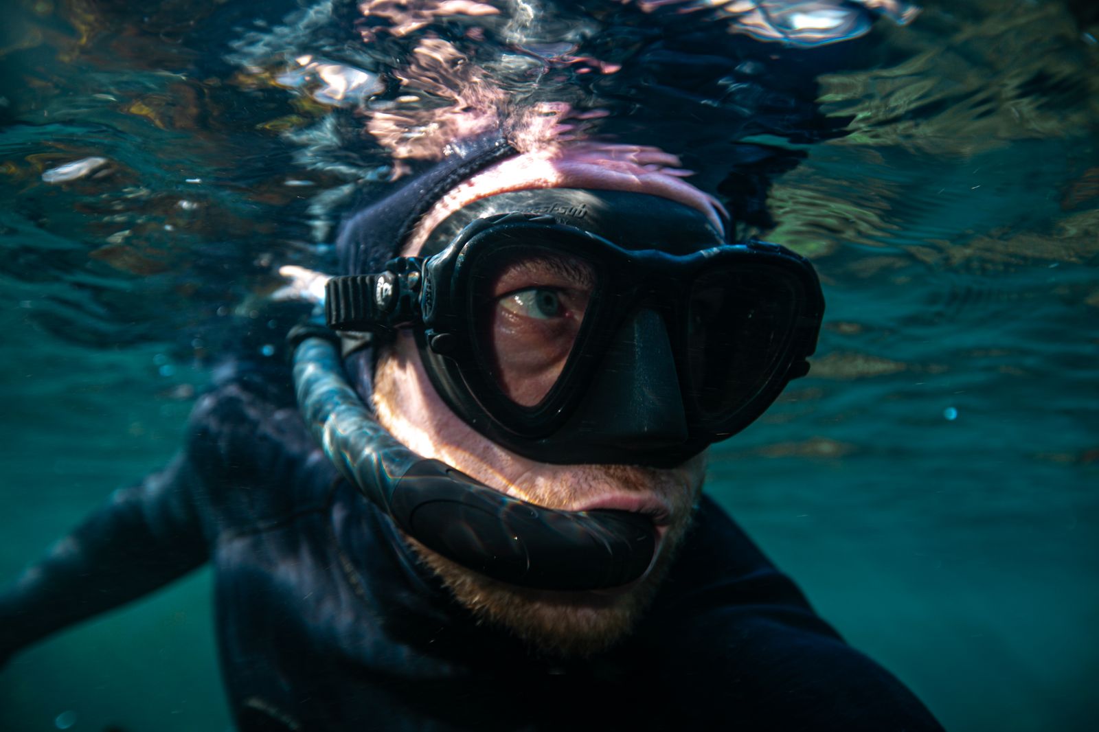 A diver at the surface in mask and snorkel